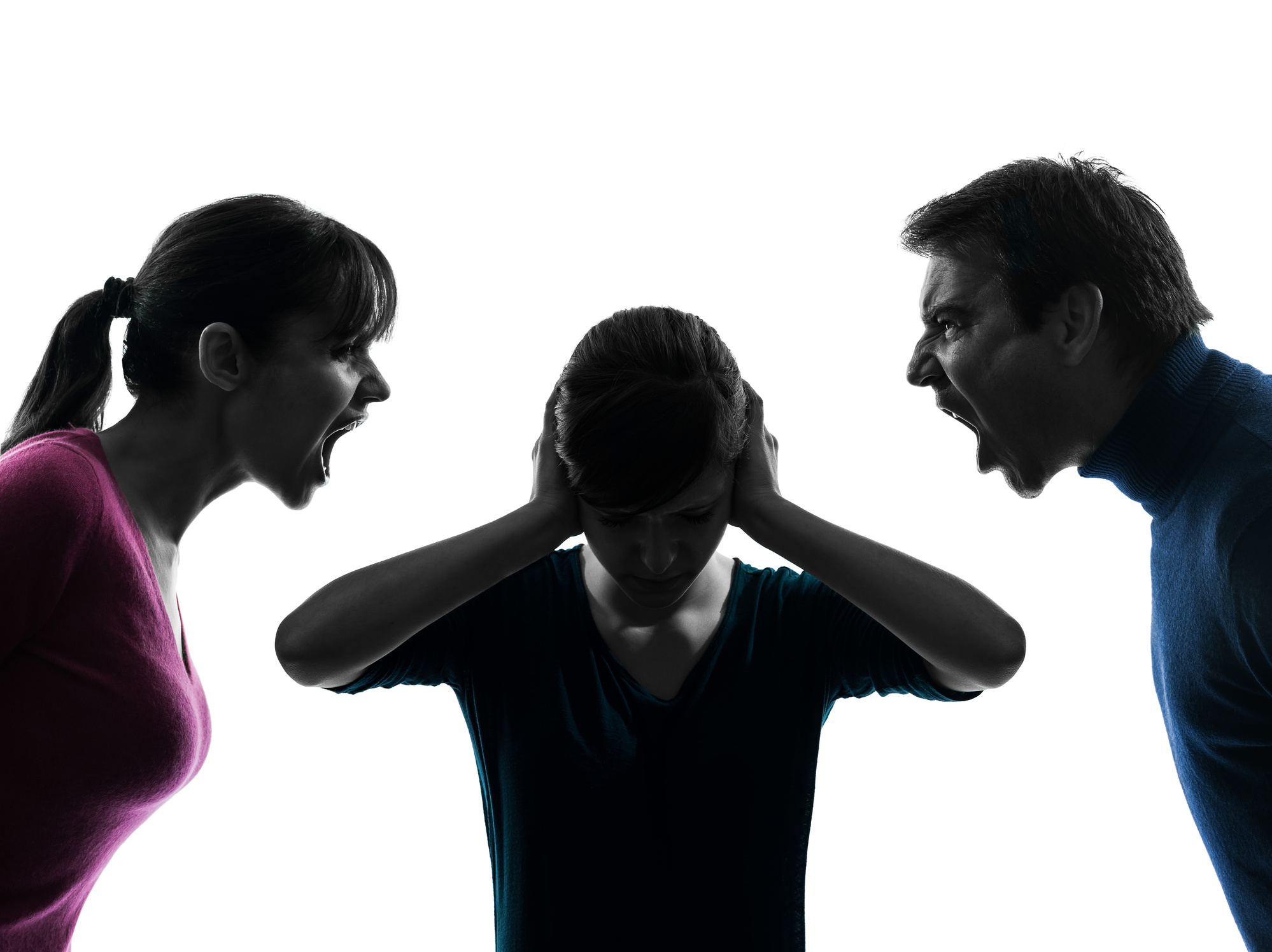 Silhouette of child caught between arguing parents